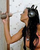 Sexy music listening babe jerks a big fake fetish pecker