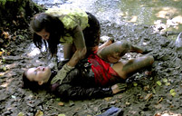 Two sexy clothed sweeties love rolling in a large river