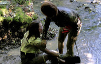 Two sexy clothed sweeties love rolling in a large river