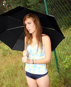  Daring teenage beauty masturbating outdoors in the rain