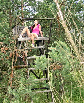 A very cute daring teenager enjoys masturbating outside