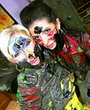  Two pretty hot clothed girls playing with loads of paint