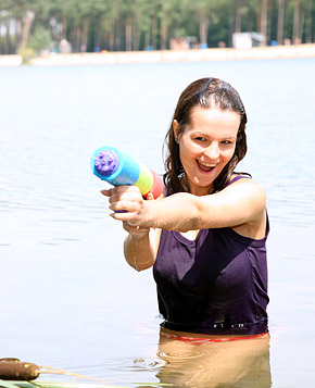 Very cute swimming teenager blowing pecker on the beach