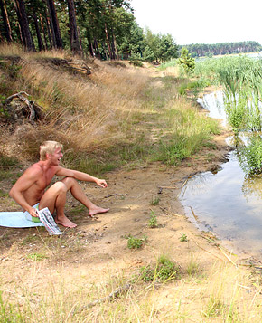 Very cute swimming teenager blowing pecker on the beach