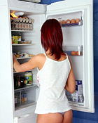 Teenage girl with red hair caresses her smoking hot body