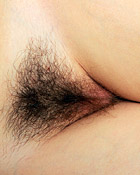 Very hairy horny brunette petting her cooch and titties