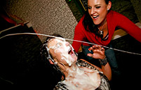 Horny babes jerking a fake jizzing cock at the sex club