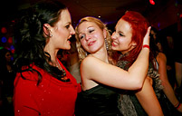 Horny babes jerking a fake jizzing cock at the sex club