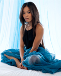 Terrific asian Angel called Yoko stripping in blue studio...