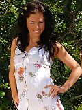 Flirty brunette sheds summer dress and dildos twat in garden