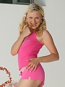 Flirty blonde cutie strips and fucks pink dildo outside