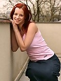 Fiery redhead teen strips and spreads pink pussy outdoors