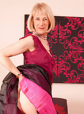 Hazel May
 Naked Anilos beauty fondles her mature pink snatch before she masturbates with a purple dildo