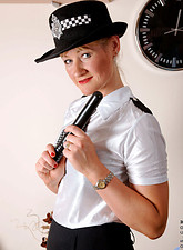 Horny policewoman plunges a billy club in her fuck box before she takes off her undies