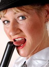 Horny policewoman plunges a billy club in her fuck box before she takes off her undies