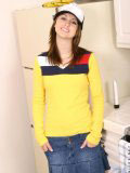 Sweet teen in a truckers cap and a tight yellow top looks hot