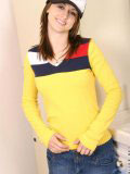 Sweet teen in a truckers cap and a tight yellow top looks hot