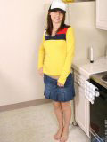 Sweet teen in a truckers cap and a tight yellow top looks hot