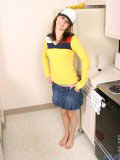 Sweet teen in a truckers cap and a tight yellow top looks hot