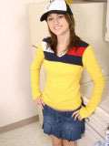 Sweet teen in a truckers cap and a tight yellow top looks hot