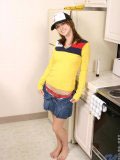 Sweet teen in a truckers cap and a tight yellow top looks hot