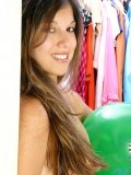 Long haired fresh teen posing just with balloons around her