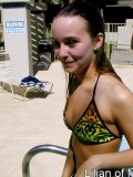 Sexy teen gets all wet in the swimming pool