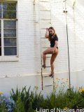 Upskirt shot of blonde teen climbing ladder