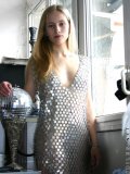 Slender blond teen hottie struts around in a metal dress you gotta see to believe