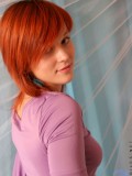 Naked redhead teenie bragging her phat tight ass as she crouches on the floor