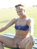 Hottie outside frolicing with her shaved pussy