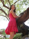 Cutie in the trees has on a sexy red dress she shows some upskirt shots and her small boobs