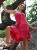 Cutie in the trees has on a sexy red dress she shows some upskirt shots and her small boobs