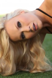  Michaela strips off her bikini by the pool.