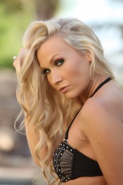  Michaela strips off her bikini by the pool.