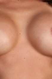 Monique Alexander struts her sexy stuff out to the back patio where she does a steamy striptease for all her fans.